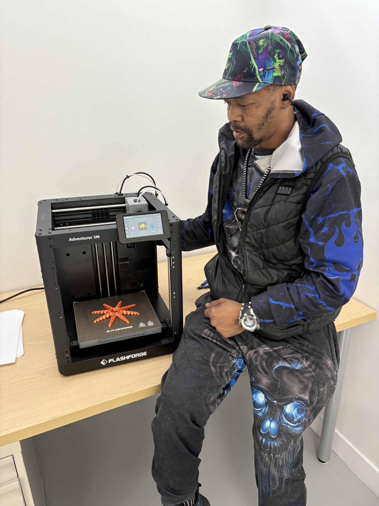 Client proudly displaying a 3D printed starfish created during technology training at Mid State Vocational Rehabilitation