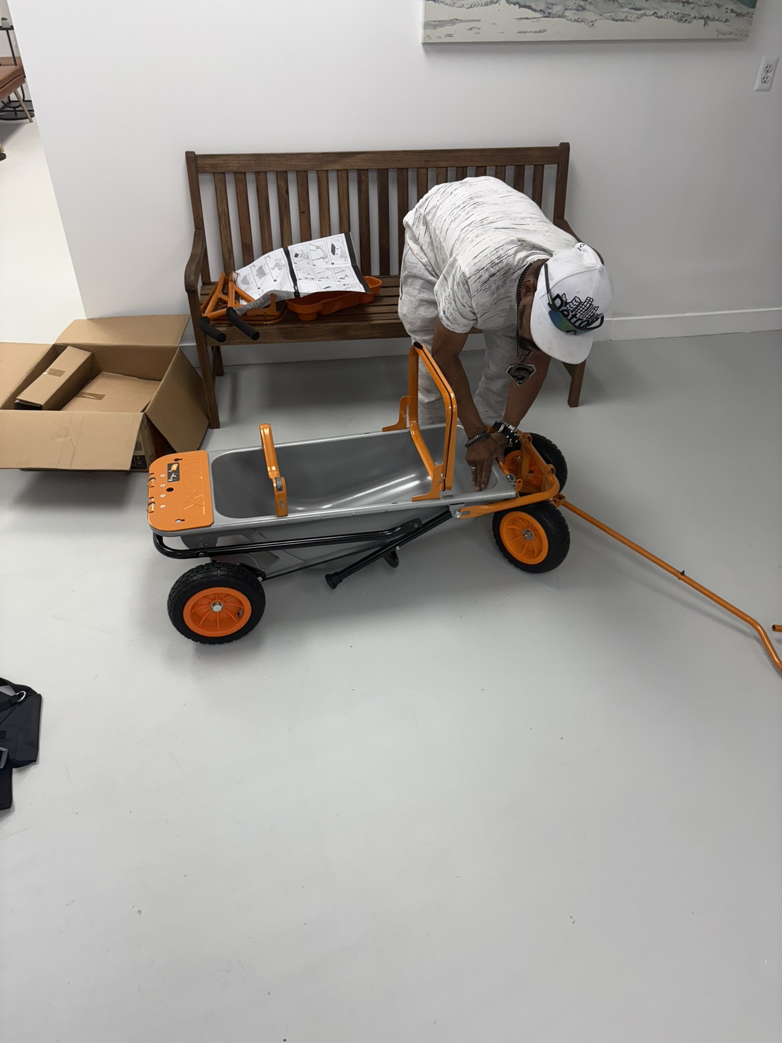 Client engaging in a practical work simulation by assembling a mechanical wagon at Mid State Vocational Rehabilitation